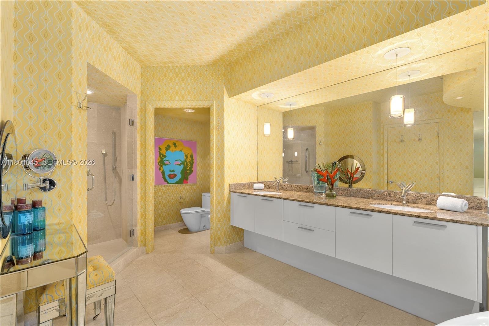 400 Alton Road, Unit 1101 Miami Beach, FL 33139 - Photo 2 of 4 a spacious bathroom with a sink mirror and toilet