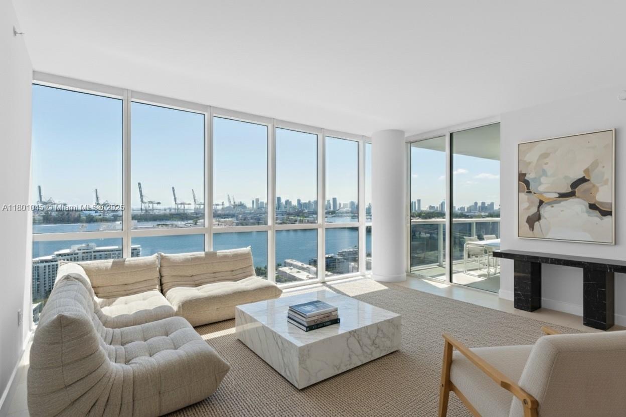 400 Alton Road, Unit 1101 Miami Beach, FL 33139 - Photo 2 of 31 a living room with furniture and a large window