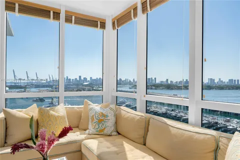 a spacious bathroom with a sink mirror and toilet