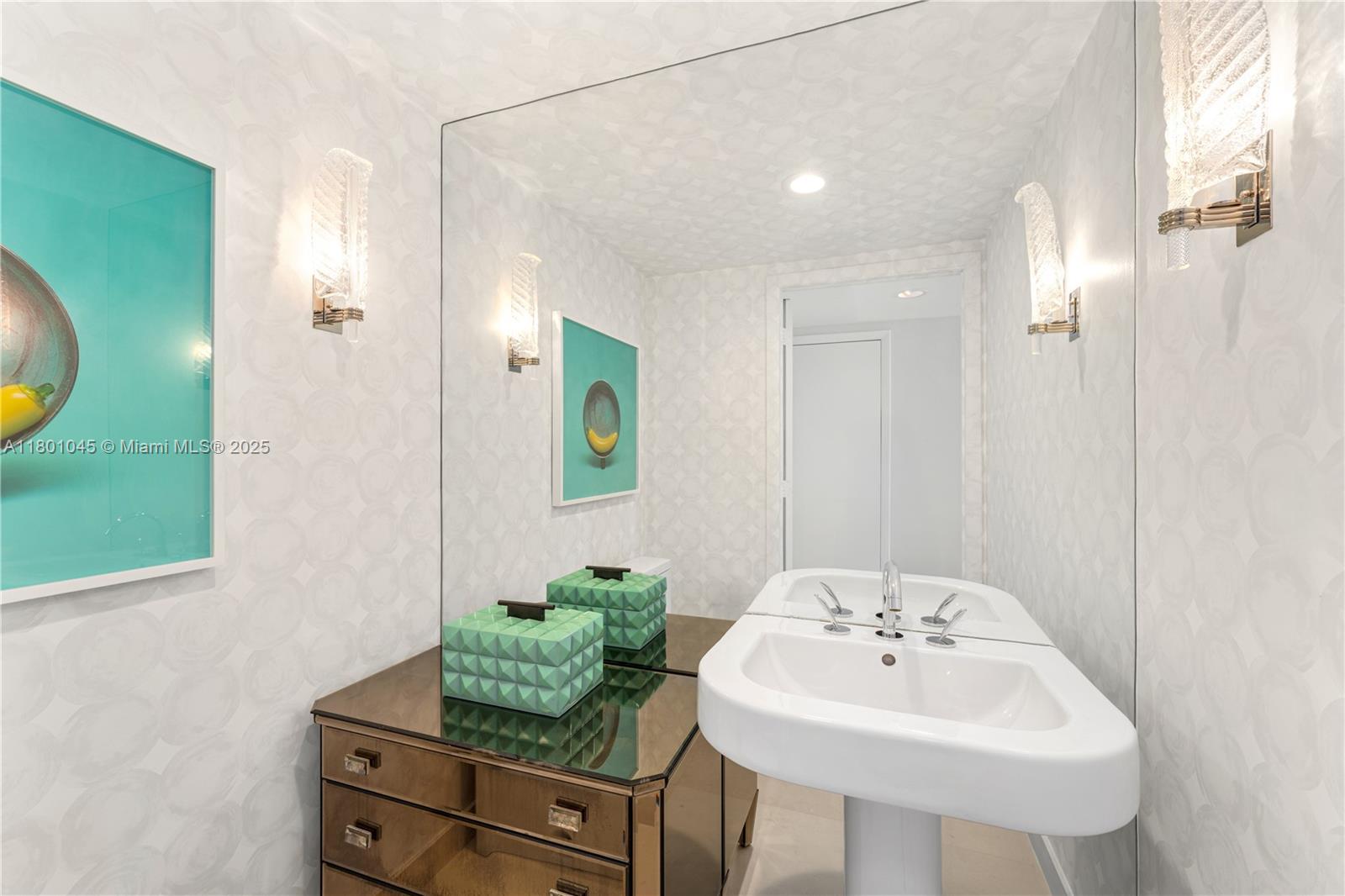 400 Alton Road, Unit 1101 Miami Beach, FL 33139 - Photo 26 of 31 a bathroom with a sink and a mirror