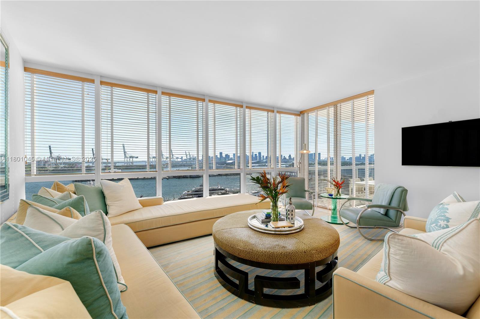 400 Alton Road, Unit 1101 Miami Beach, FL 33139 - Photo 27 of 31 a living room with furniture and a large window