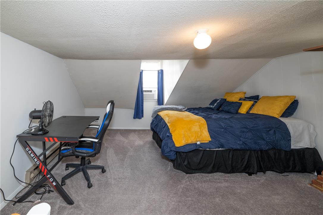 649 Furnace Street Emmaus, PA 18049 - Photo 23 of 24 Sloped ceilings and a dormer window create a cozy bedroom retreat.