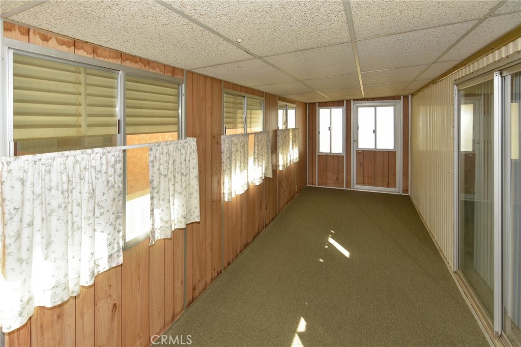 23456 Ottawa Road, Unit 4 Apple Valley, CA 92308 - Photo 12 of 17 a view of hallway with windows