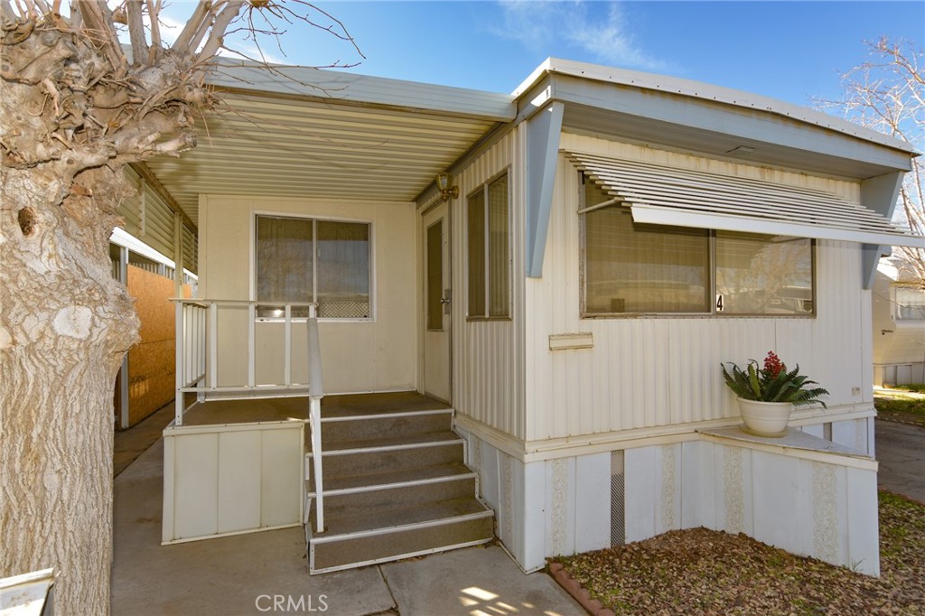 23456 Ottawa Road, Unit 4 Apple Valley, CA 92308 - Photo 2 of 17 a view of front door of house