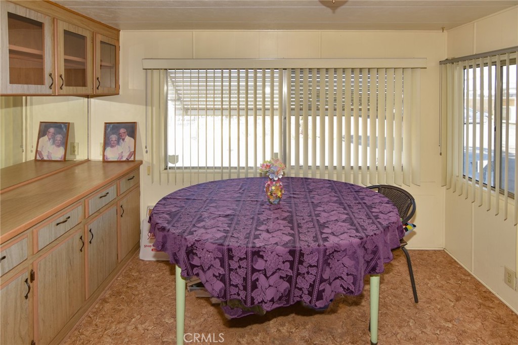 23456 Ottawa Road, Unit 4 Apple Valley, CA 92308 - Photo 3 of 17 a bed sitting in a bedroom next to a window
