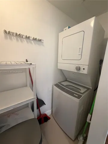 a kitchen with granite countertop a stove and cabinets