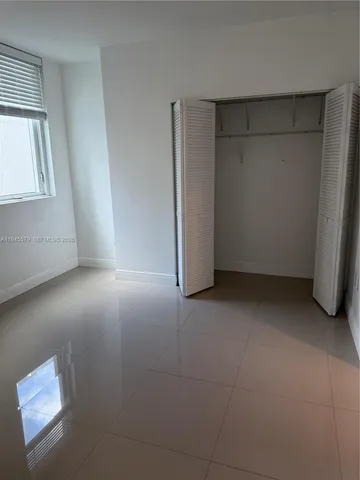 a bathroom with a toilet a sink and a shower