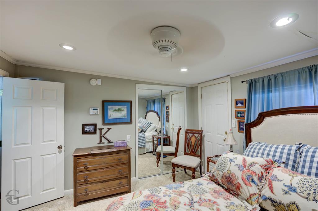 459 Dollie Moore Road Ringgold, LA 71068 - Photo 10 of 19 Recessed lighting, ceiling fan, mirrored closet doors, and light-colored carpeting