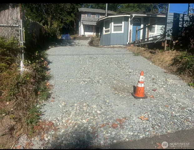 an aerial view of a house with yard and outdoor seating