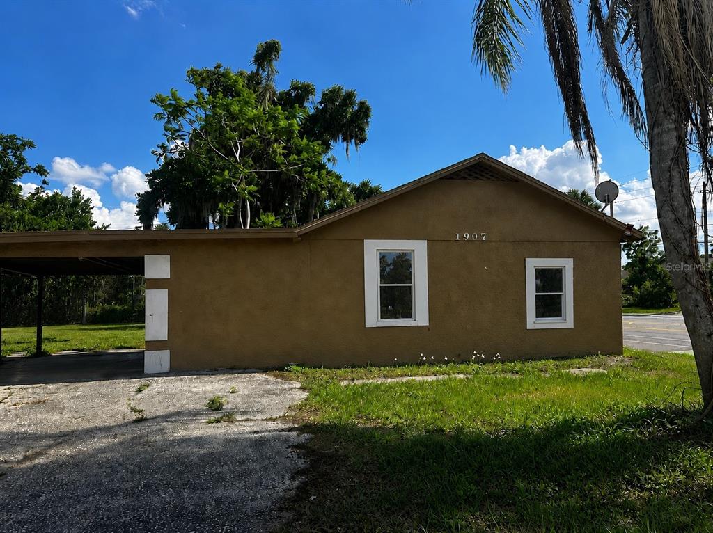 1907 Rio Grande Avenue Orlando, FL 32805 - Photo 1 of 17 a front view of a house with a yard