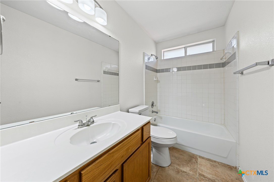 305 James Loop Killeen, TX 76542 - Photo 16 of 32 a bathroom with a sink a toilet and shower