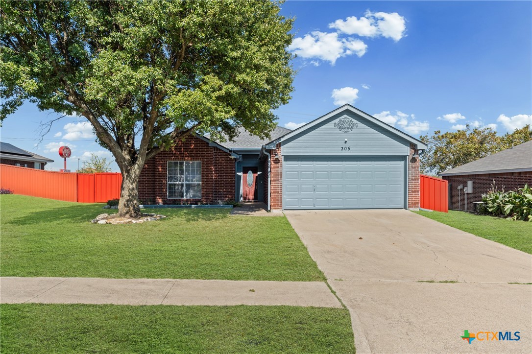 305 James Loop Killeen, TX 76542 - Photo 2 of 32 a front view of a house with a yard