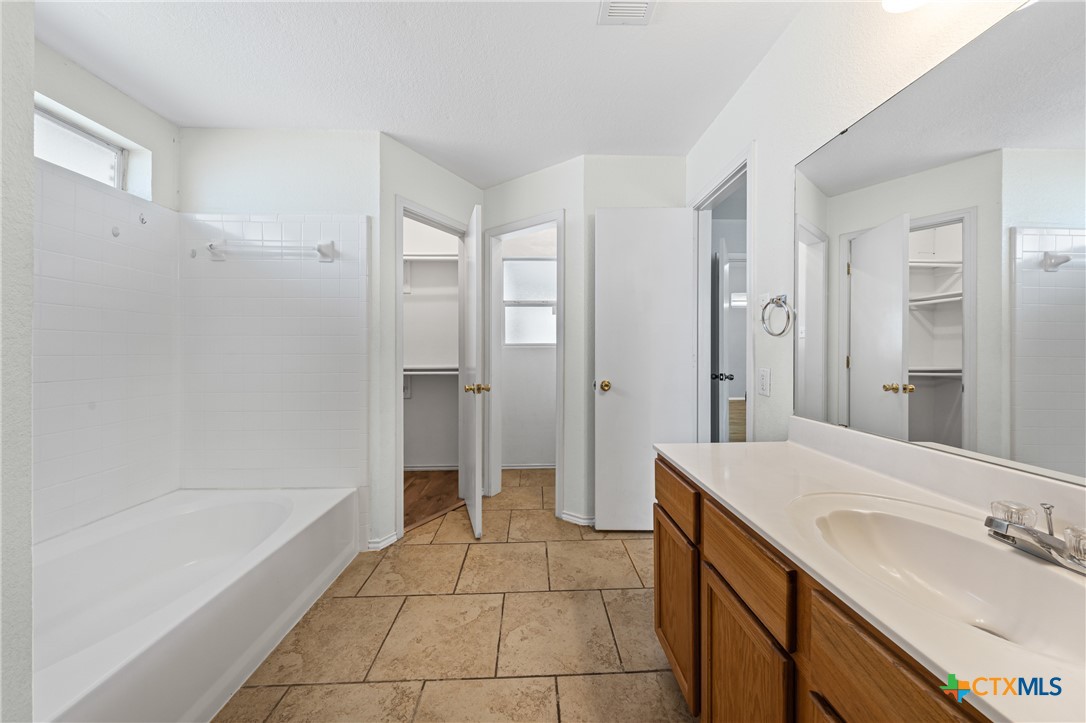 305 James Loop Killeen, TX 76542 - Photo 21 of 32 a bathroom with a sink a toilet and shower