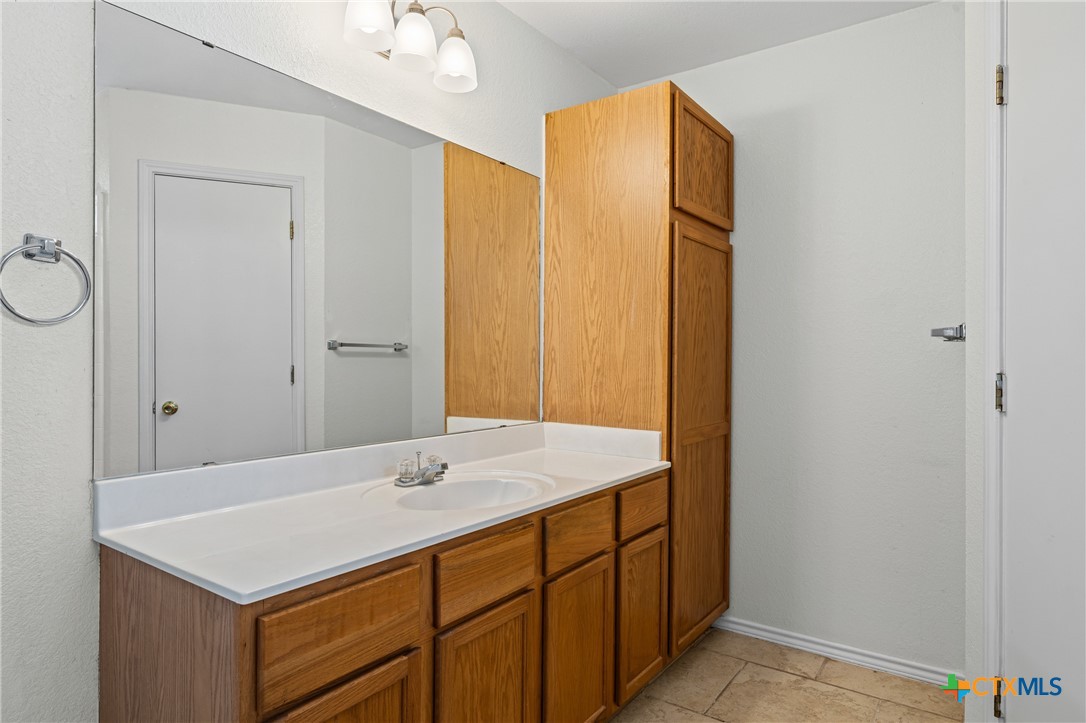 305 James Loop Killeen, TX 76542 - Photo 23 of 32 a bathroom with a sink vanity and a mirror