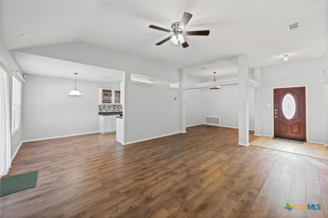 305 James Loop Killeen, TX 76542 - Photo 5 of 32 a view of empty room with wooden floor and ceiling fan