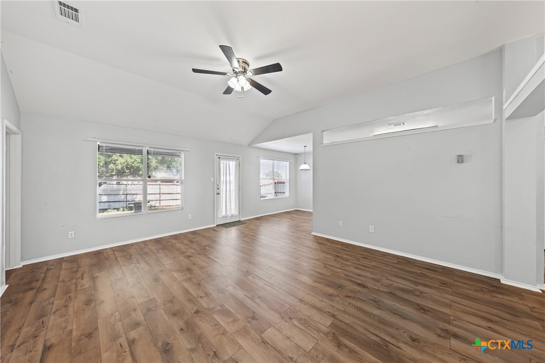 305 James Loop Killeen, TX 76542 - Photo 6 of 32 a view of an empty room with wooden floor and a window