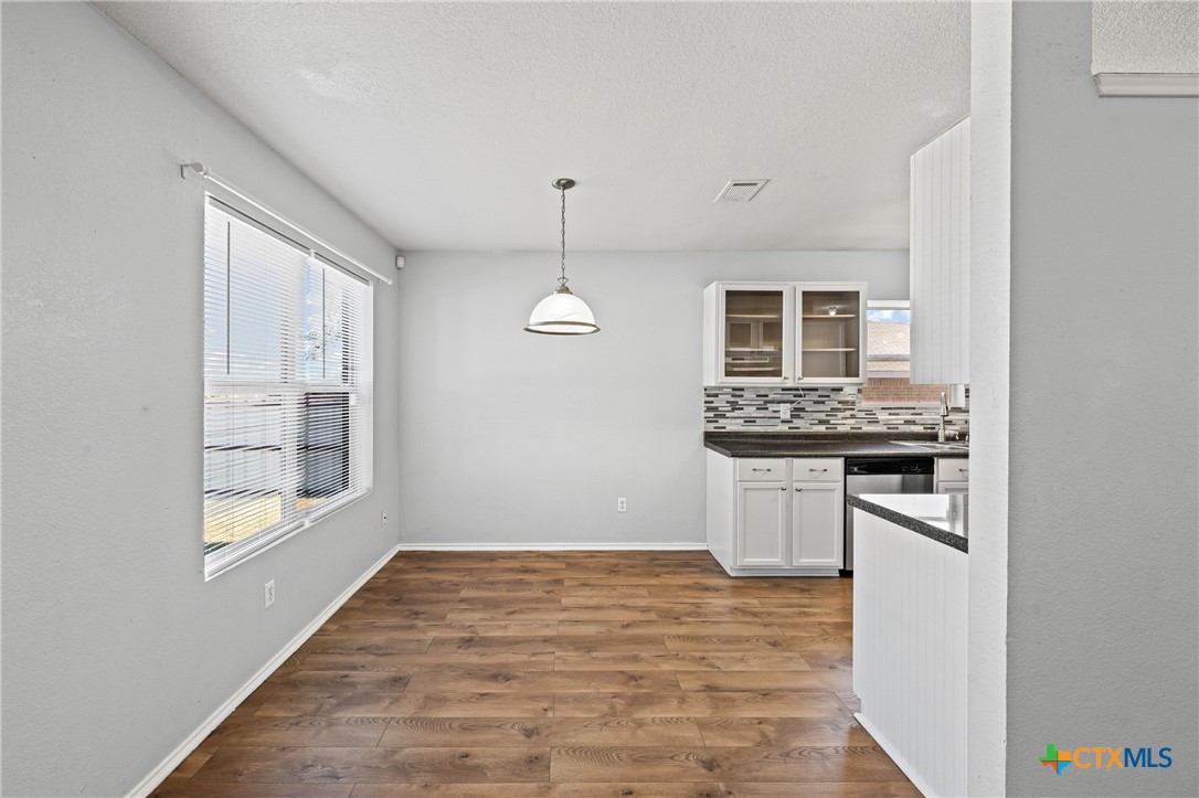 305 James Loop Killeen, TX 76542 - Photo 8 of 32 a kitchen with stainless steel appliances granite countertop a stove and a refrigerator