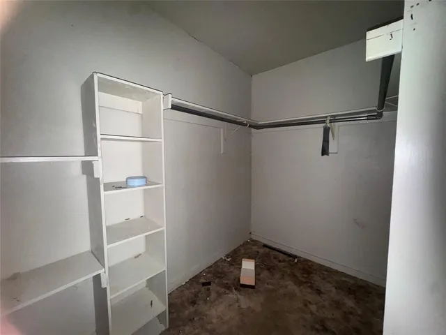 a view of an empty walk in closet