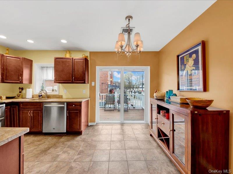 2576 Harding Avenue Bronx, NY 10465 - Photo 11 of 26 a kitchen with stainless steel appliances granite countertop a stove a sink and a refrigerator