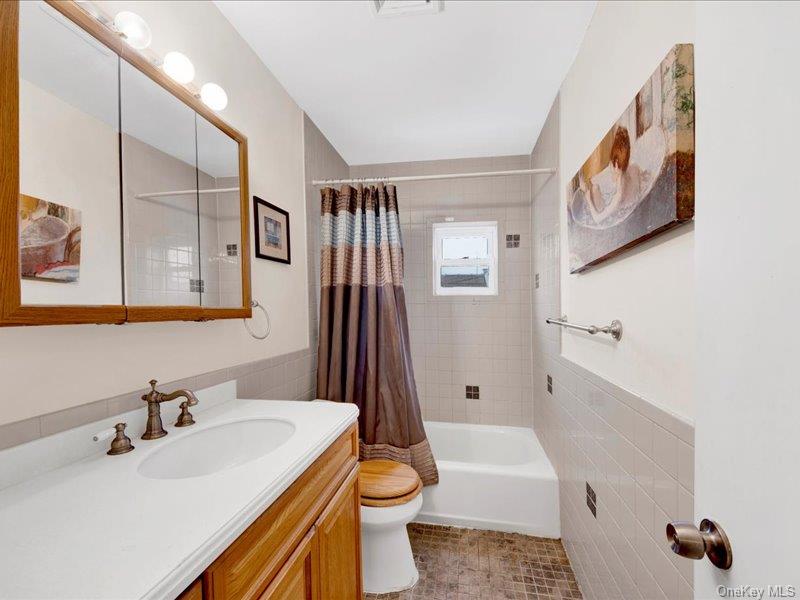 2576 Harding Avenue Bronx, NY 10465 - Photo 18 of 26 a bathroom with a sink toilet and shower