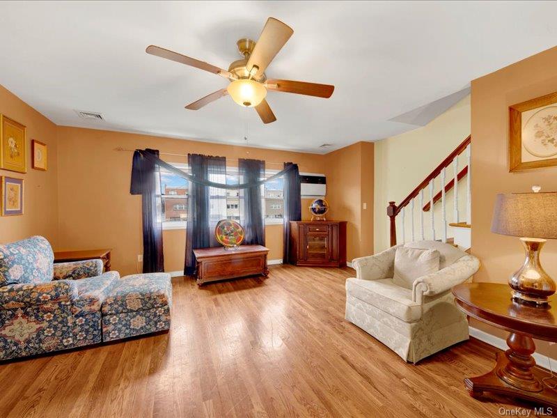 2576 Harding Avenue Bronx, NY 10465 - Photo 7 of 26 a living room with furniture and wooden floor