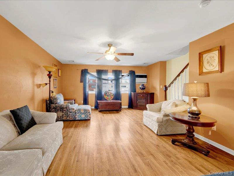 2576 Harding Avenue Bronx, NY 10465 - Photo 8 of 26 a living room with furniture and wooden floor