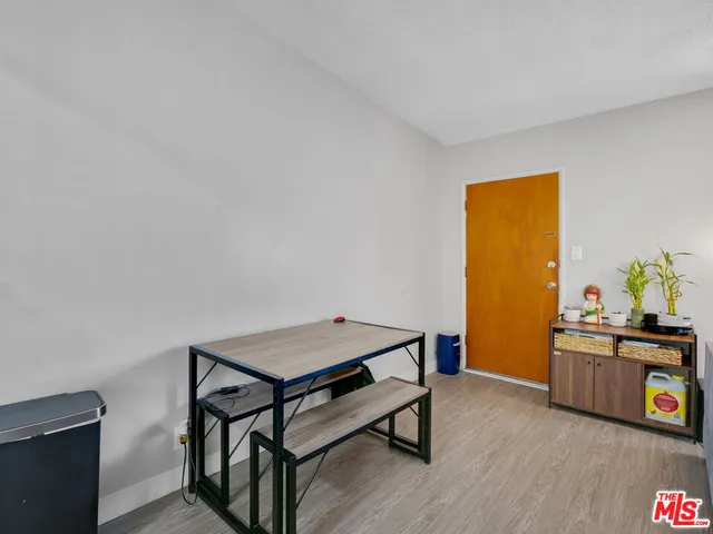 a reading room with furniture and wooden floor