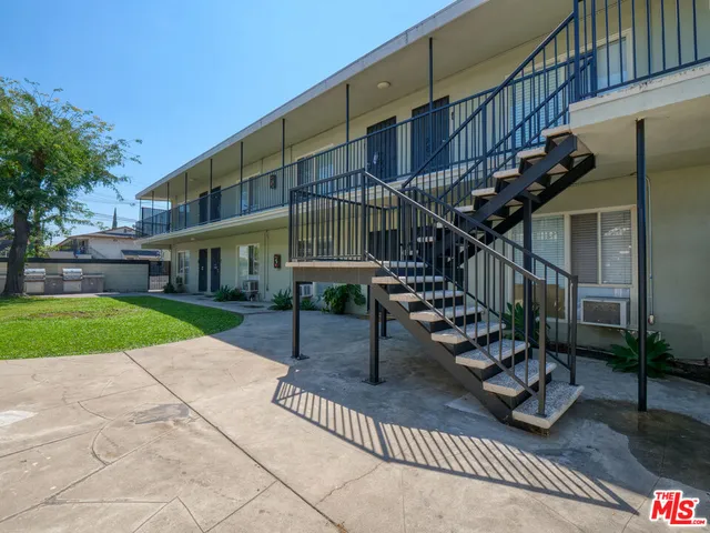 a view of a building with a yard
