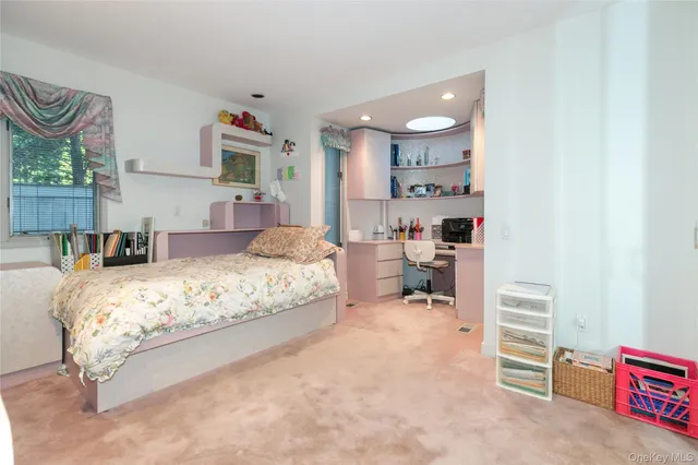 a bedroom with a bed and a cabinets