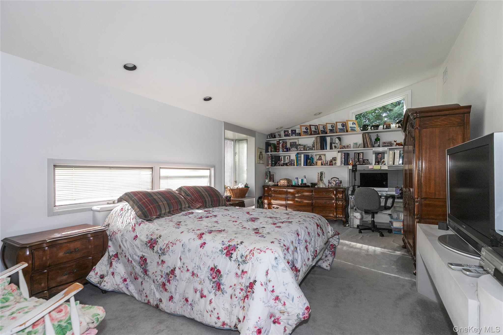 1 Franklin Road Great Neck, NY 11024 - Photo 18 of 30 a bedroom with a bed and a television