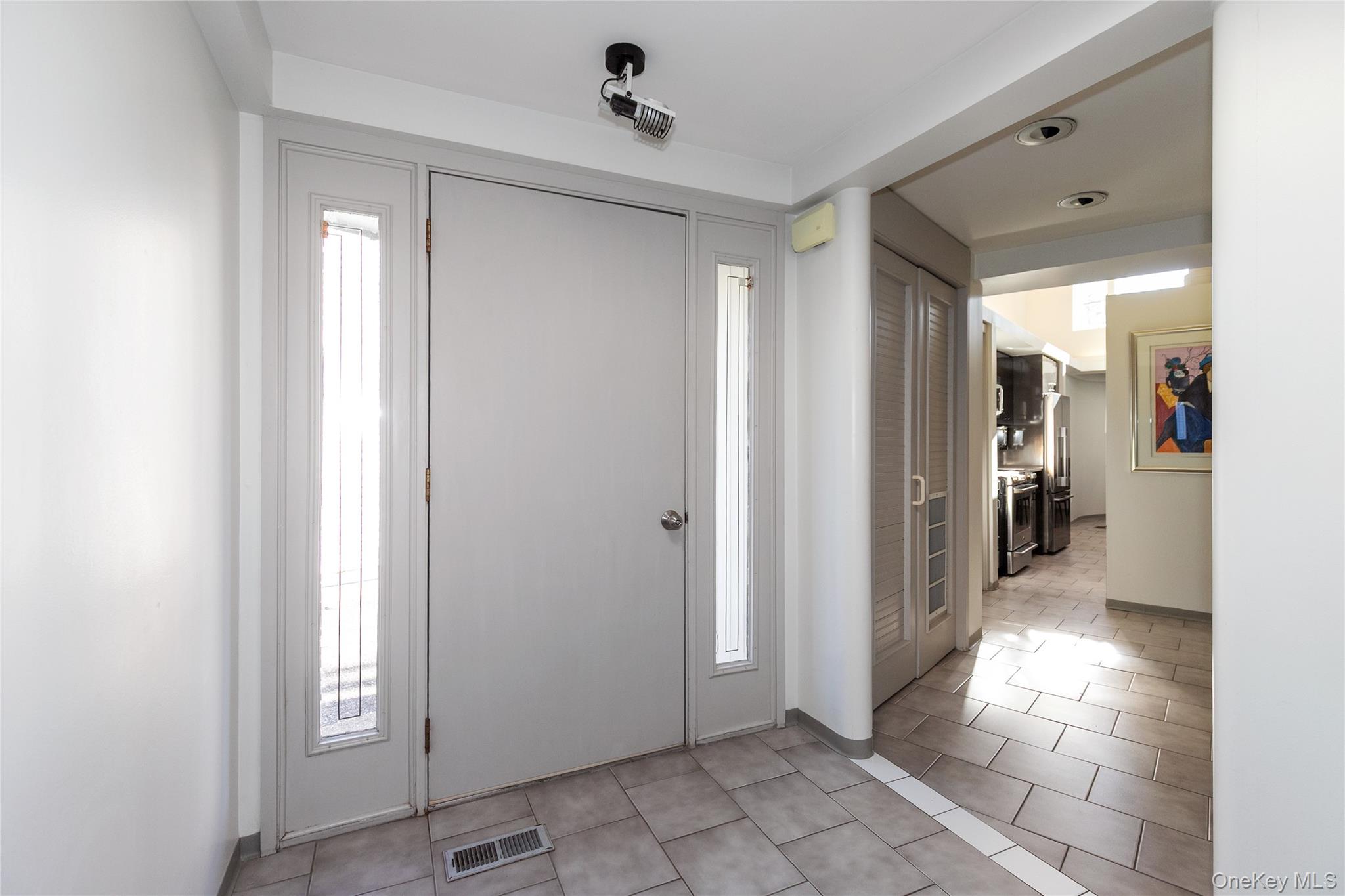1 Franklin Road Great Neck, NY 11024 - Photo 2 of 30 a view of a hallway with wooden shelves