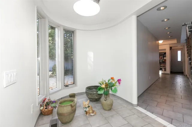 a flower pot with a potted plant