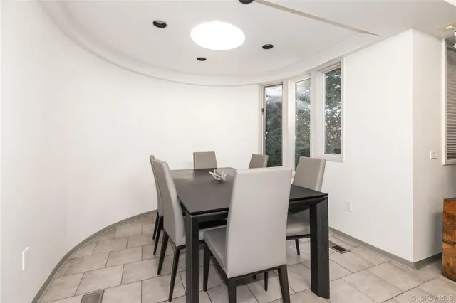 a view of a dining room with furniture and window