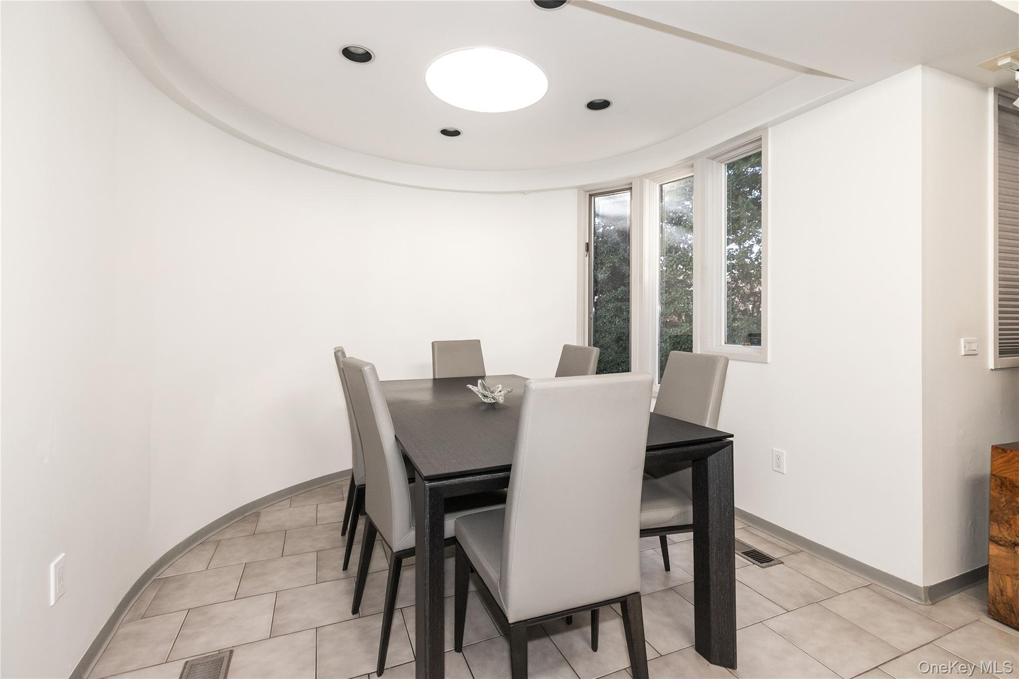 1 Franklin Road Great Neck, NY 11024 - Photo 7 of 30 a view of a dining room with furniture and window