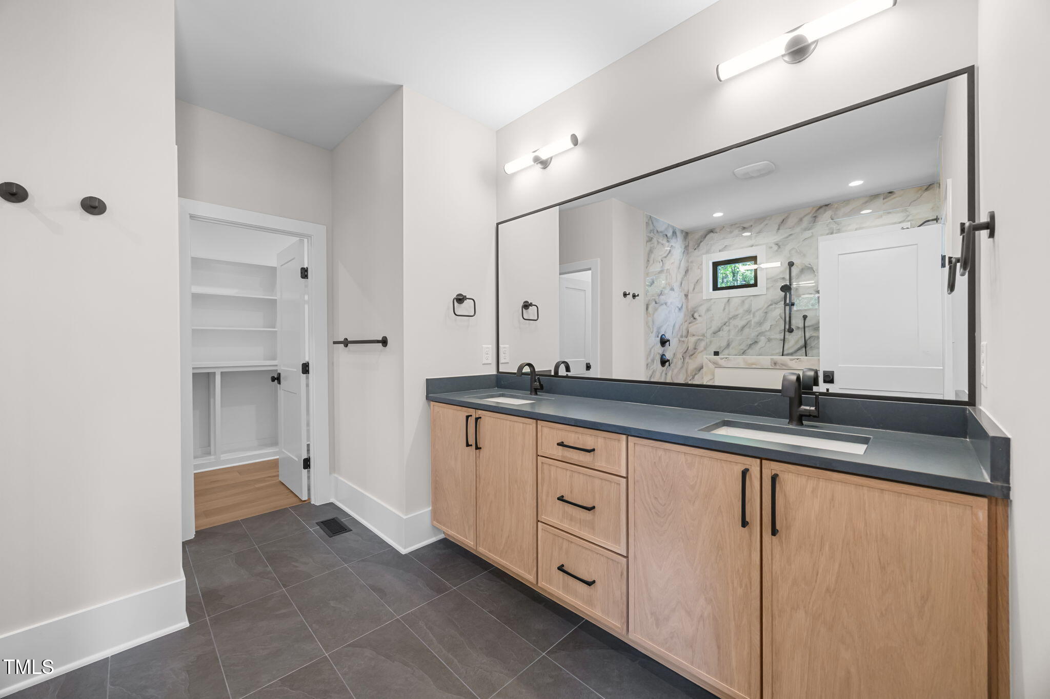 2321 Turners Alley Raleigh, NC 27607 - Photo 32 of 43 a bathroom with a granite countertop sink and a mirror