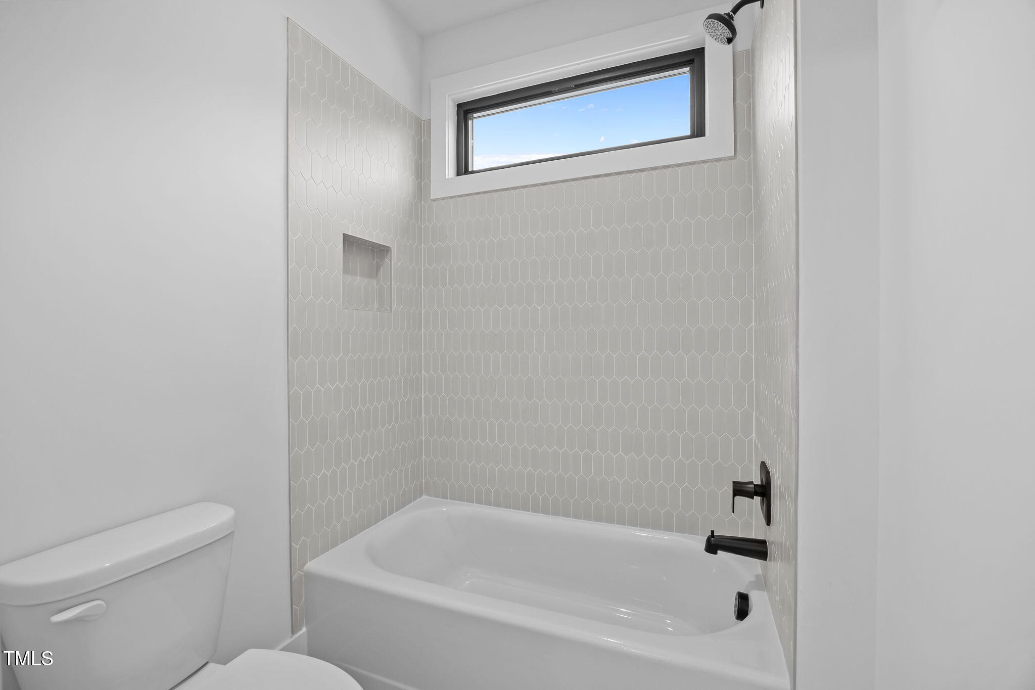 2321 Turners Alley Raleigh, NC 27607 - Photo 40 of 43 a white bath tub sitting next to a white toilet