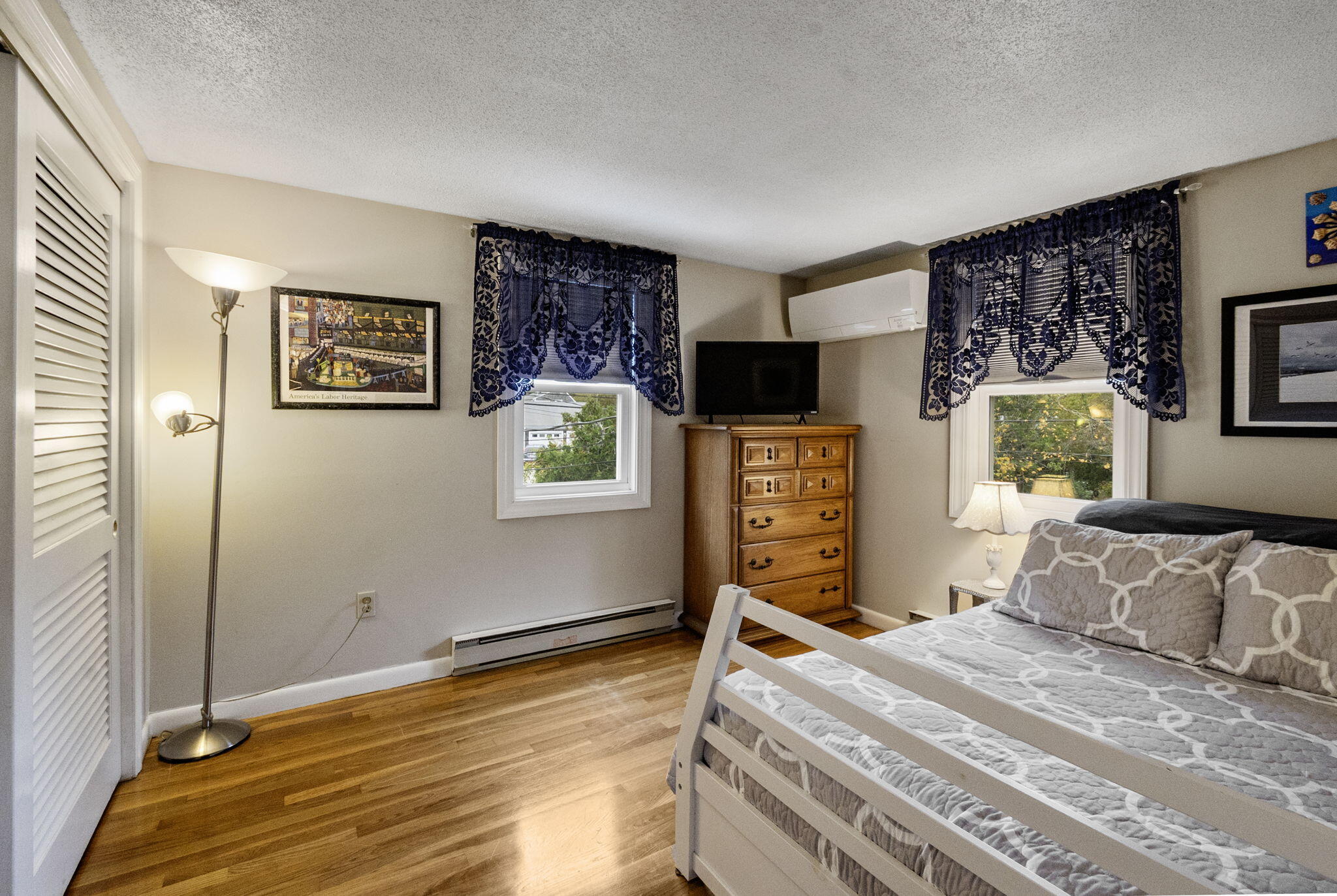 102 Sea Street Dennis Port, MA 02639 - Photo 18 of 37 a bedroom with a bed and wooden floor