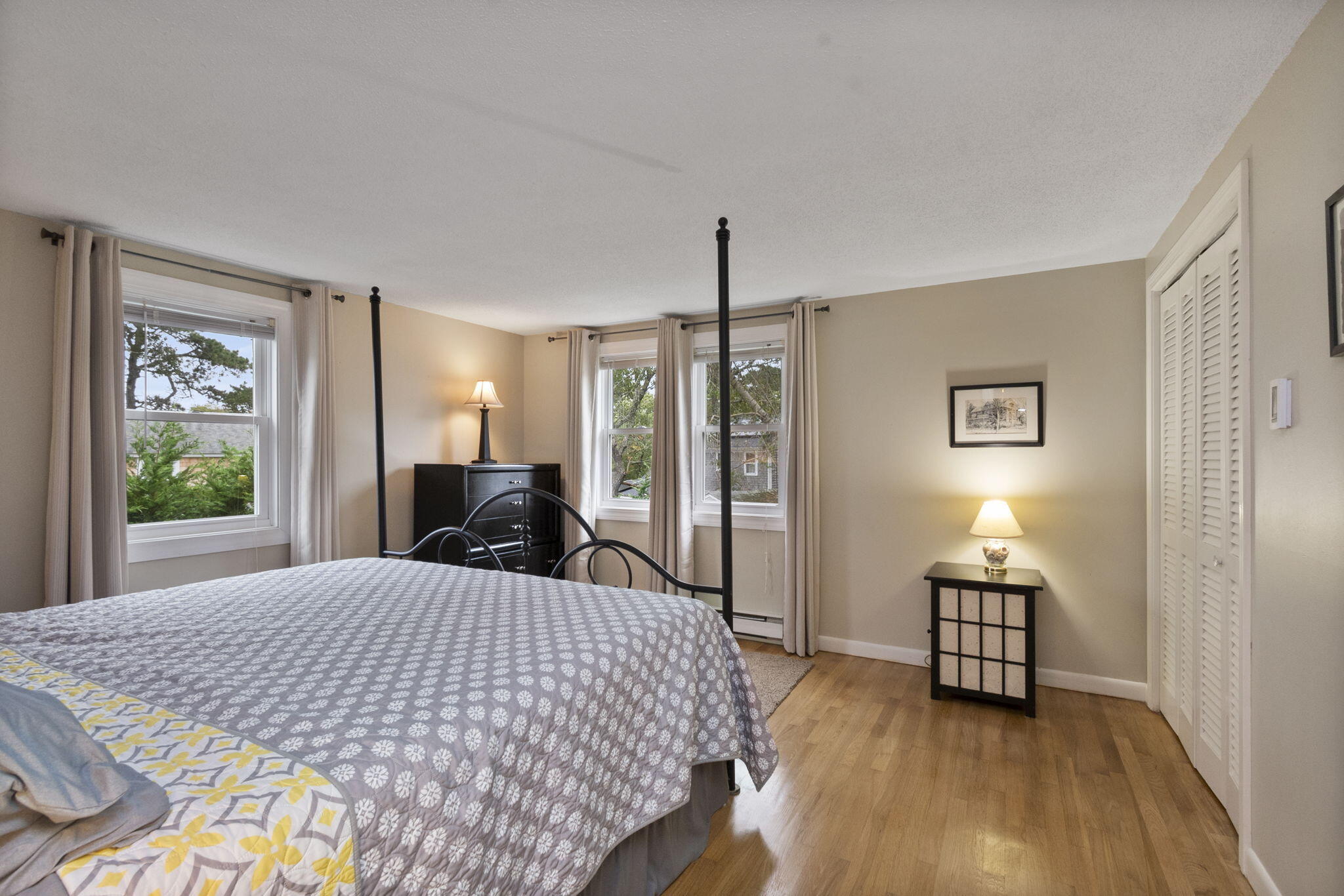 102 Sea Street Dennis Port, MA 02639 - Photo 31 of 37 a bed sitting in a spacious bedroom next to a window