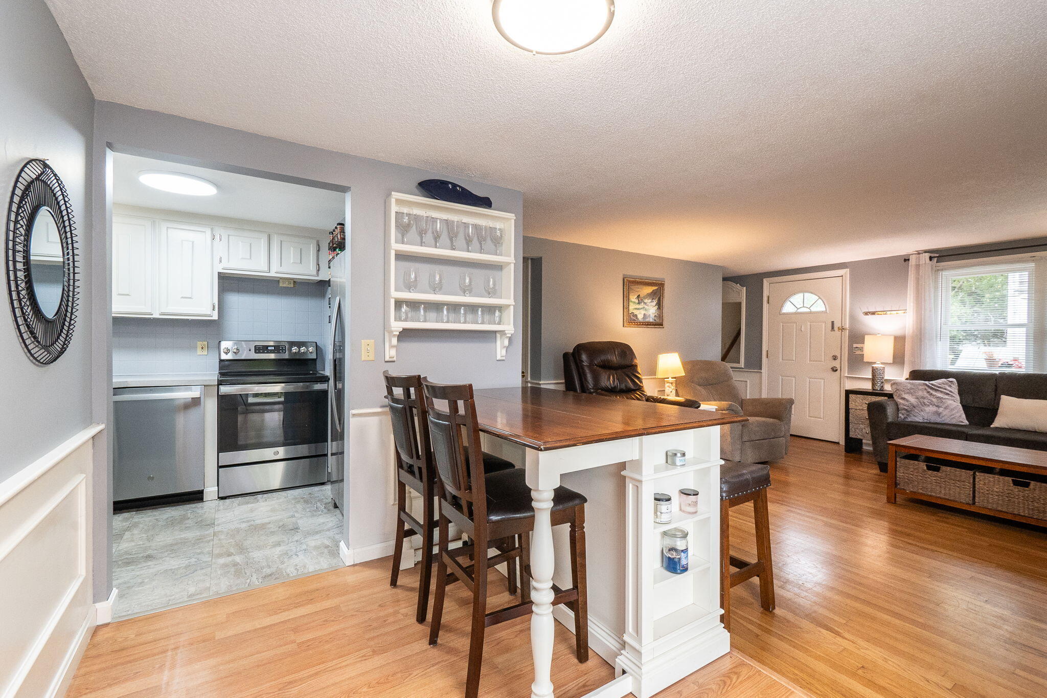 102 Sea Street Dennis Port, MA 02639 - Photo 9 of 37 a kitchen with a stove a refrigerator and a stove top oven