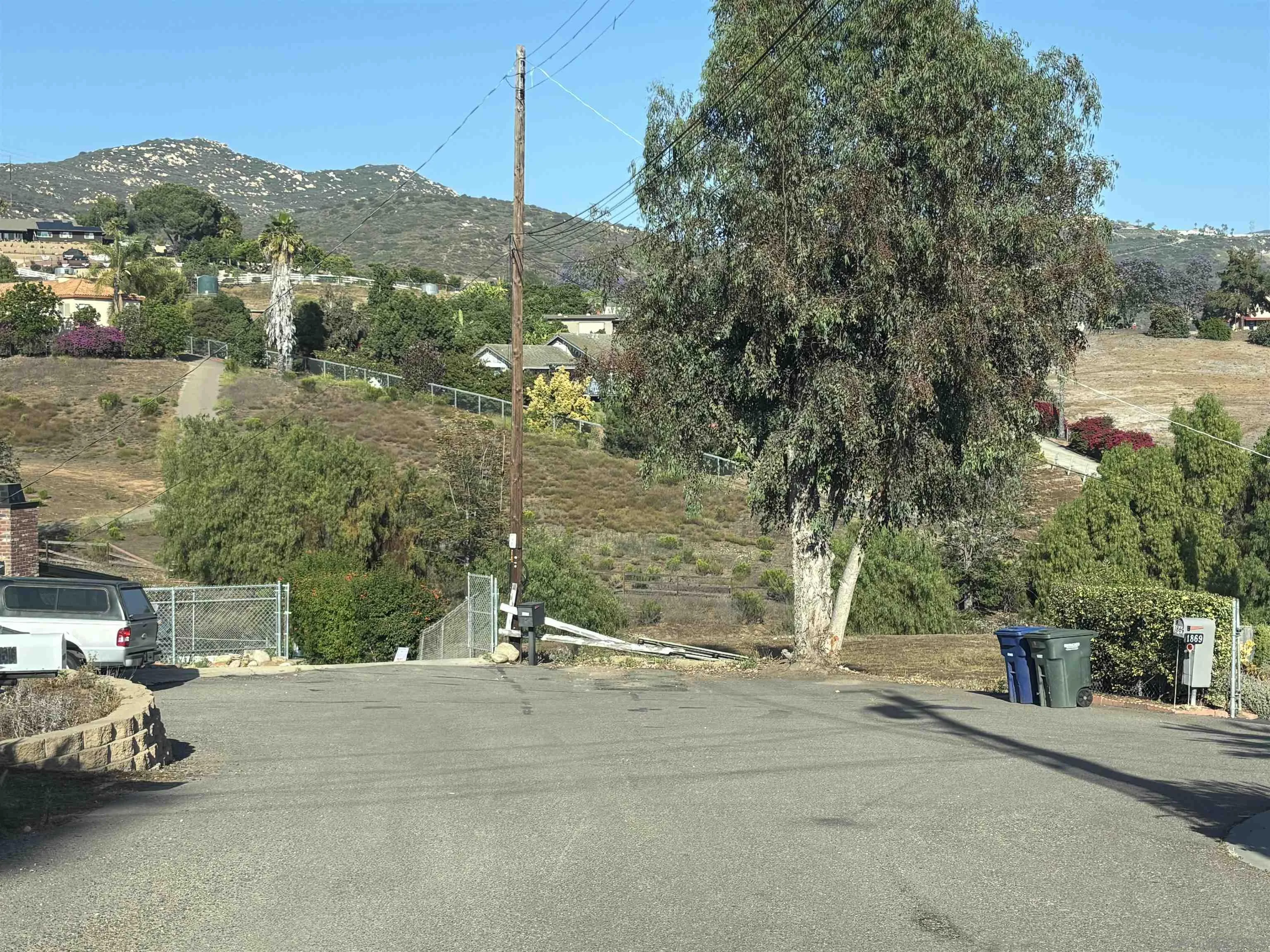 Quicker Road El Cajon, CA 92020 - Photo 11 of 12 an aerial view of a house with a yard and parking