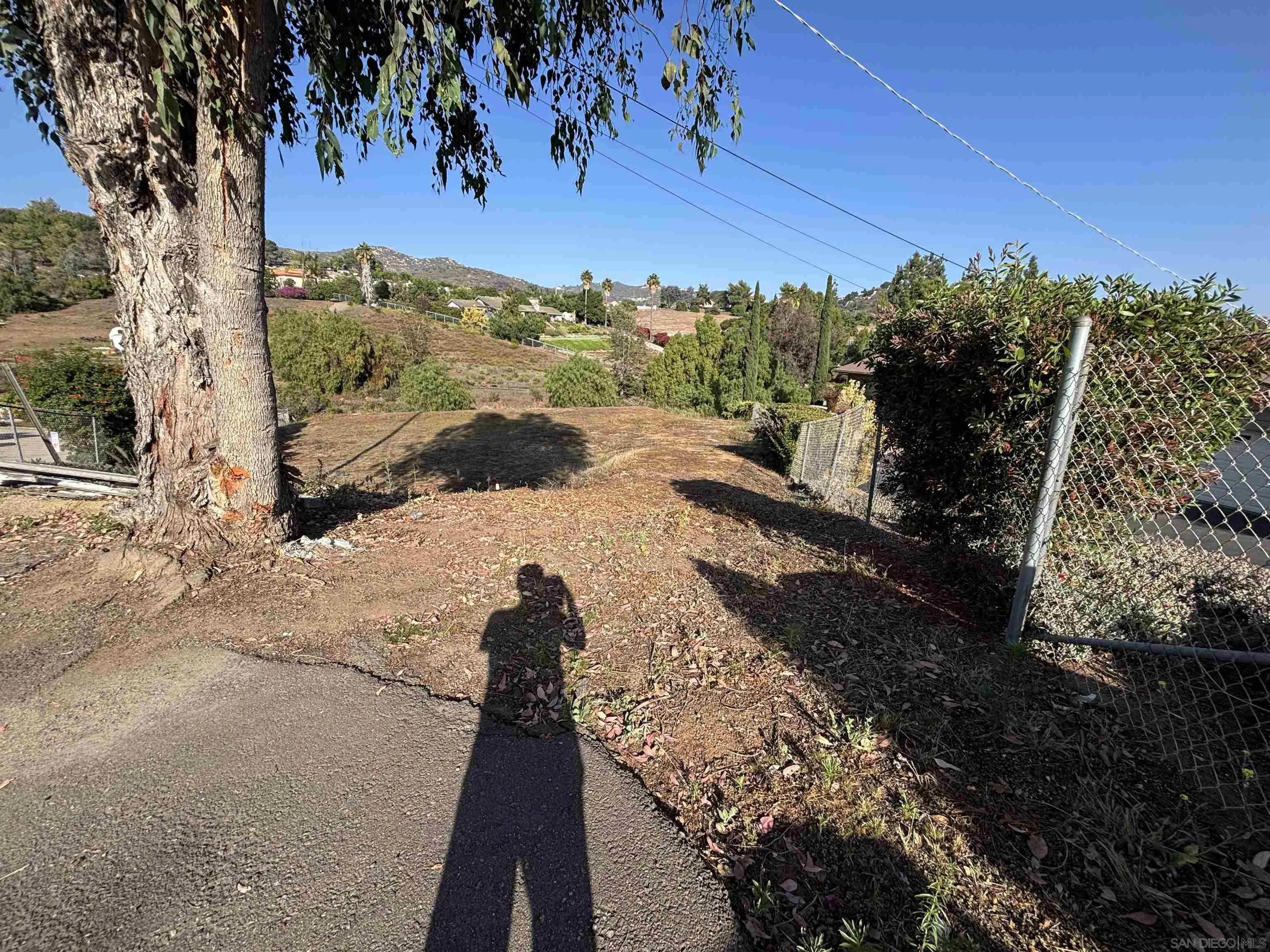 Quicker Road El Cajon, CA 92020 - Photo 6 of 12 a view of a yard with wooden fence