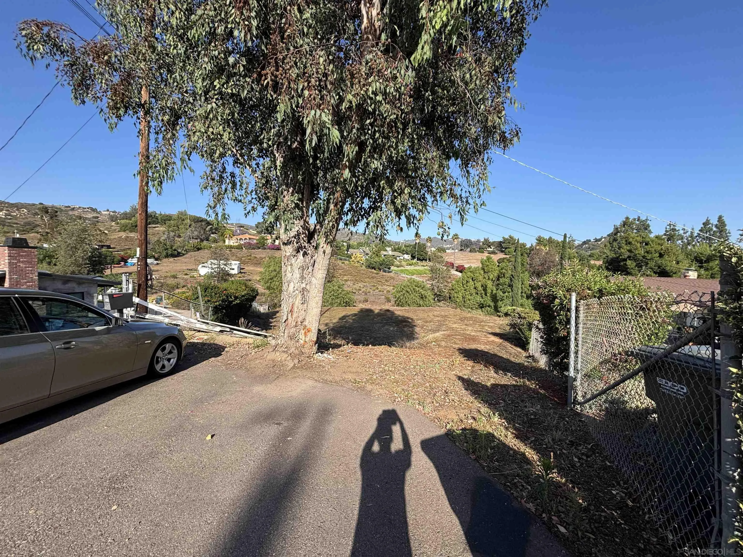 Quicker Road El Cajon, CA 92020 - Photo 10 of 12 a view of car parked on street side with trees