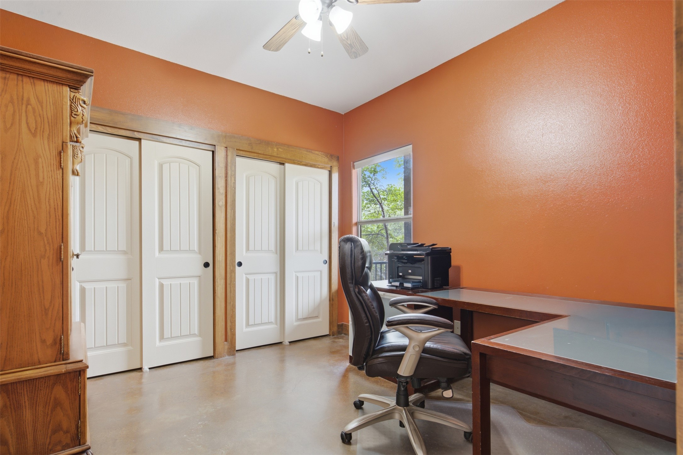 700 Augusta Circle Point Venture, TX 78645 - Photo 12 of 35 A well-lit study with durable concrete flooring and convenient closet storage.