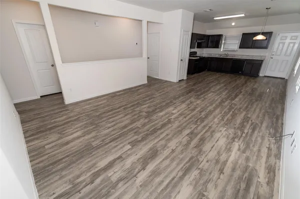 a view of kitchen with wooden floor