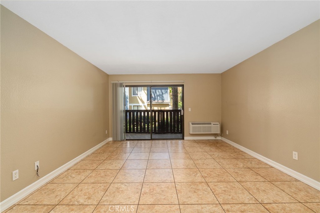 3535 Banbury Drive, Unit 119 Riverside, CA 92505 - Photo 4 of 23 a view of an empty room with a window