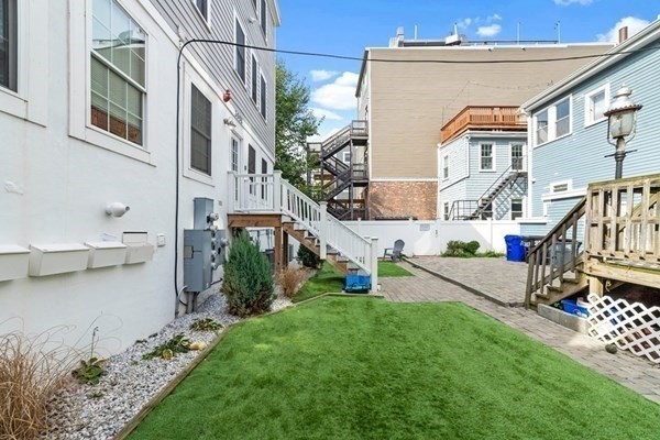 309 R Sumner Street, Unit 3 Boston, MA 02128 - Photo 14 of 16 a view of an house with backyard and sitting area