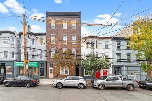 309 R Sumner Street, Unit 3 Boston, MA 02128 - Photo 16 of 16 a view of a cars park in front of a building