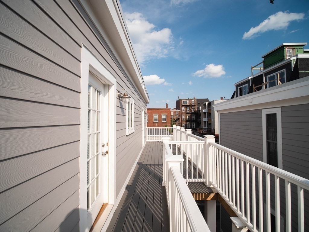 309 R Sumner Street, Unit 3 Boston, MA 02128 - Photo 9 of 16 a view of a balcony with wooden floor