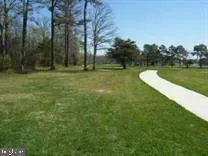 a view of a golf course with a lake