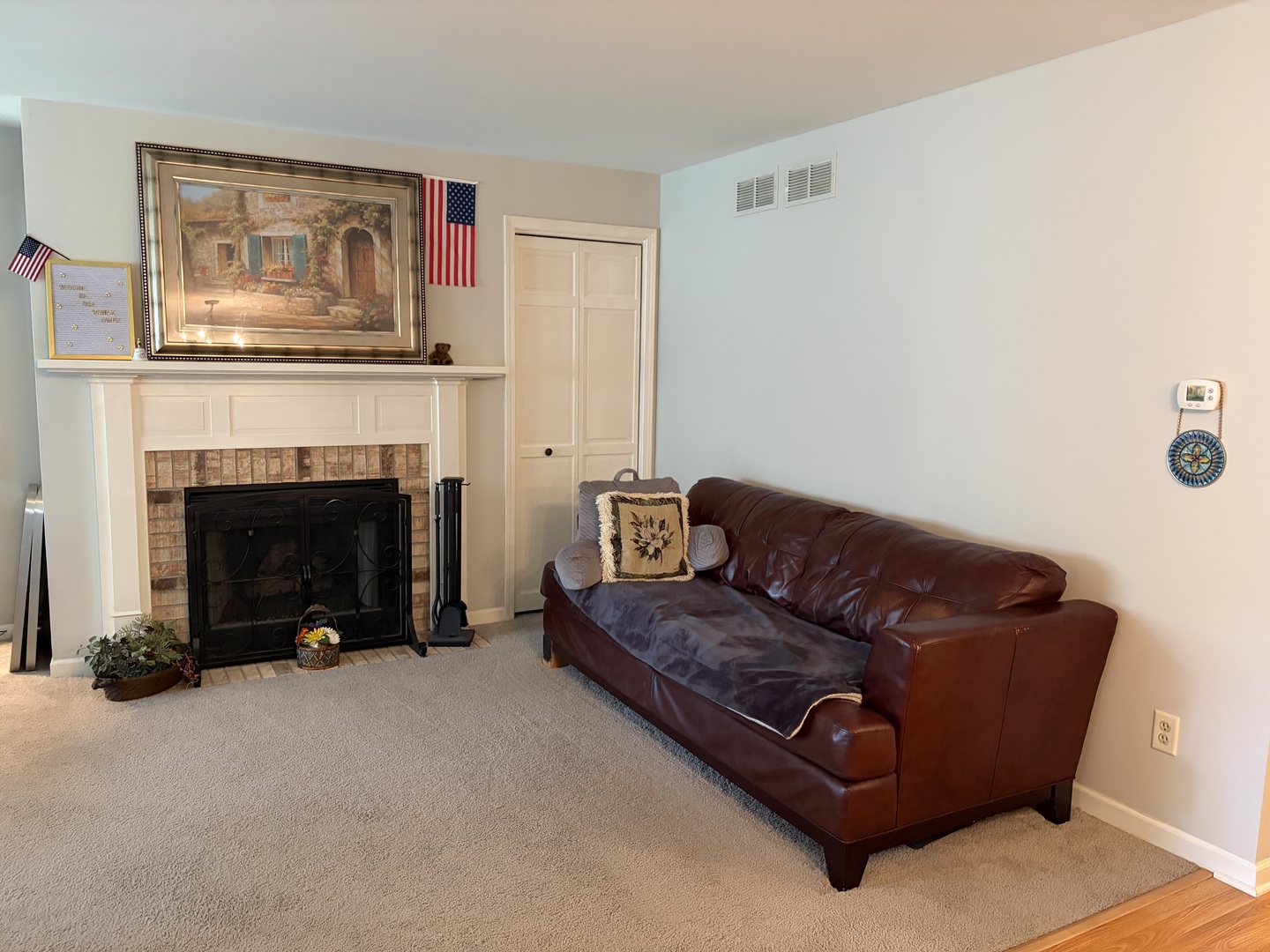 318 Dunham Place Commons, Unit 318 St. Charles, IL 60174 - Photo 4 of 20 a living room with furniture and a fireplace